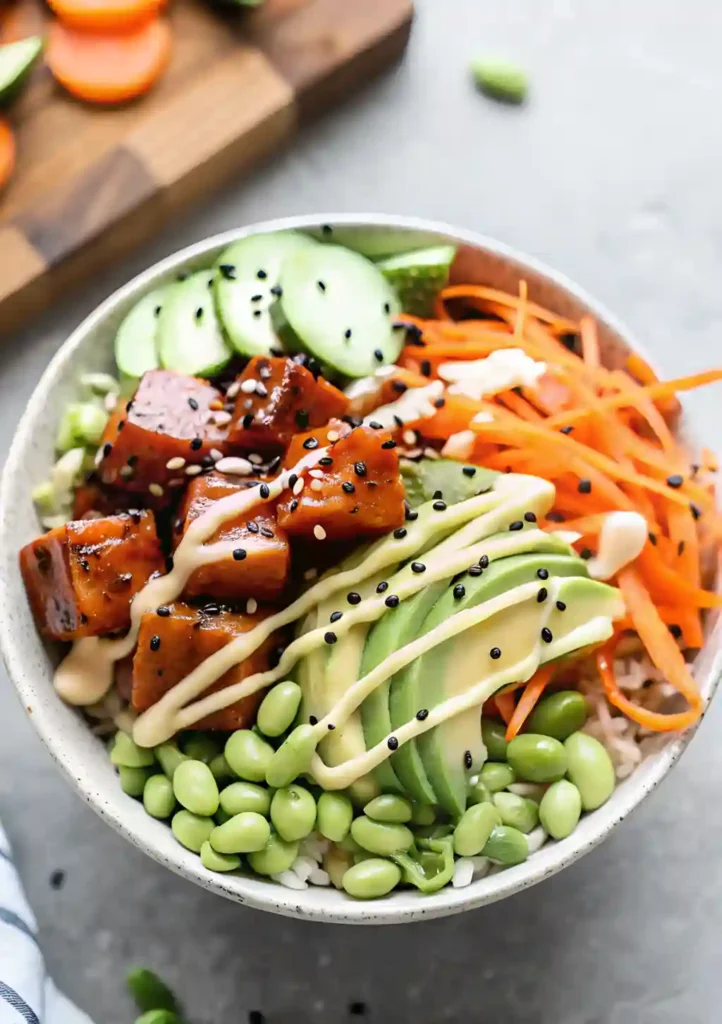 Ahi tuna poke bowl with avocado, cucumber, and rice topped with sesame seeds