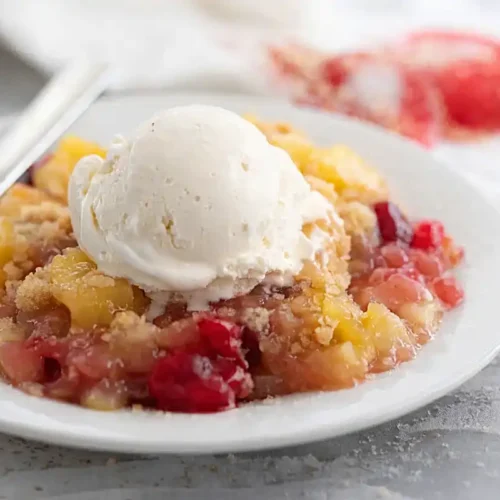 dump cake recipe with cherry pineapple filling and vanilla ice cream on top