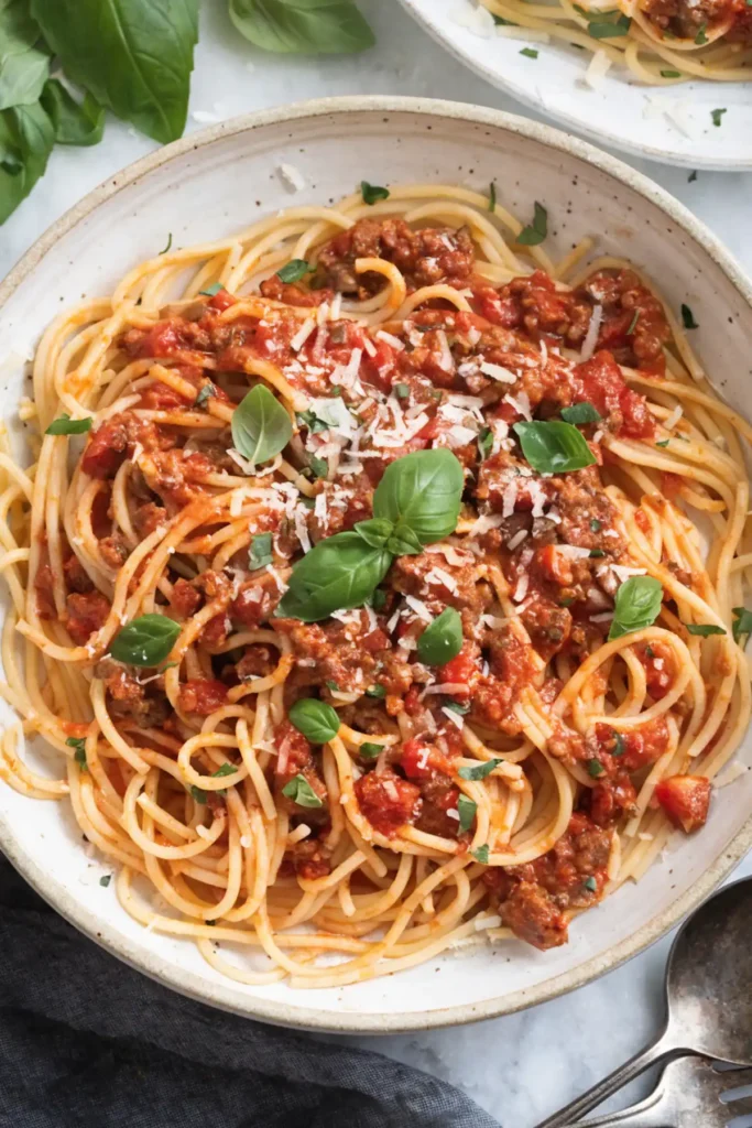 spaghetti sauce with ground beef served over spaghetti pasta